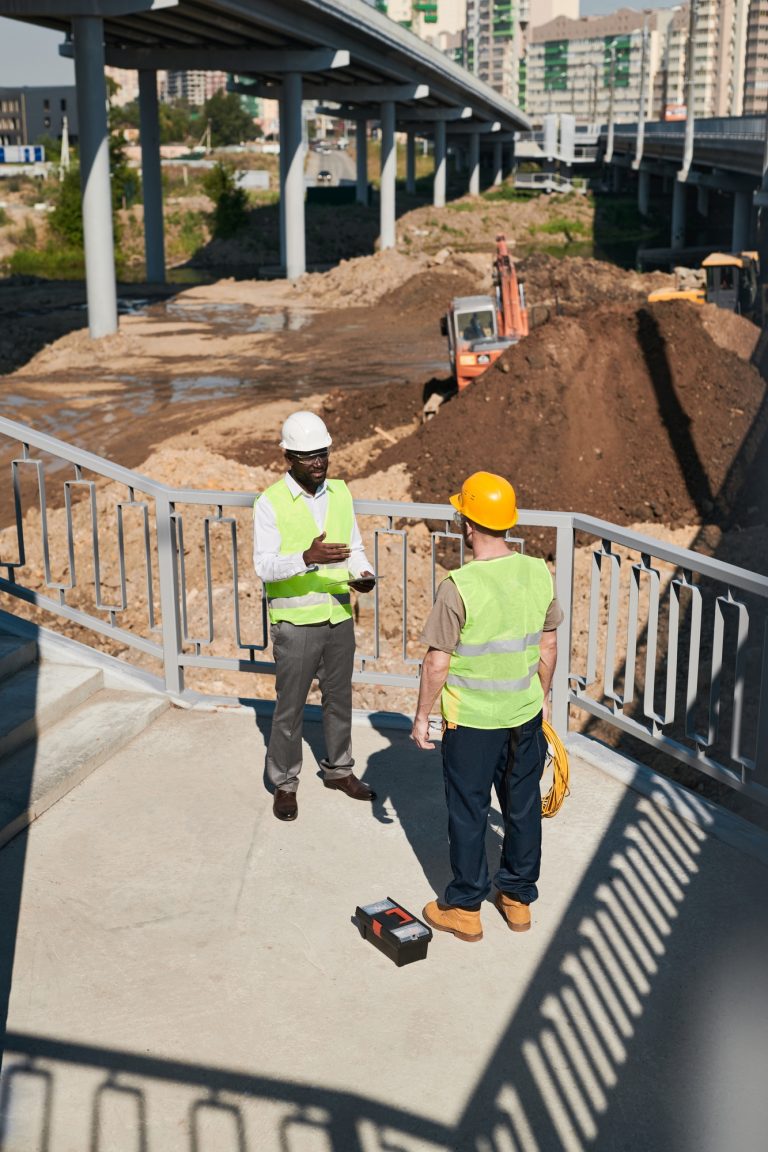 Two Workers at Construction Site